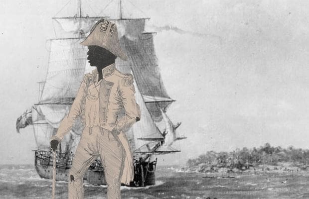 Bungaree, dressed in colonial clothes, stands in front of the Endeavour ship.