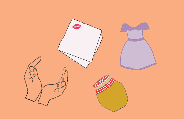 A napkin with a kiss on it, a purple dress, a jar of honey, and a pair of hands are scattered on a peach-coloured background.